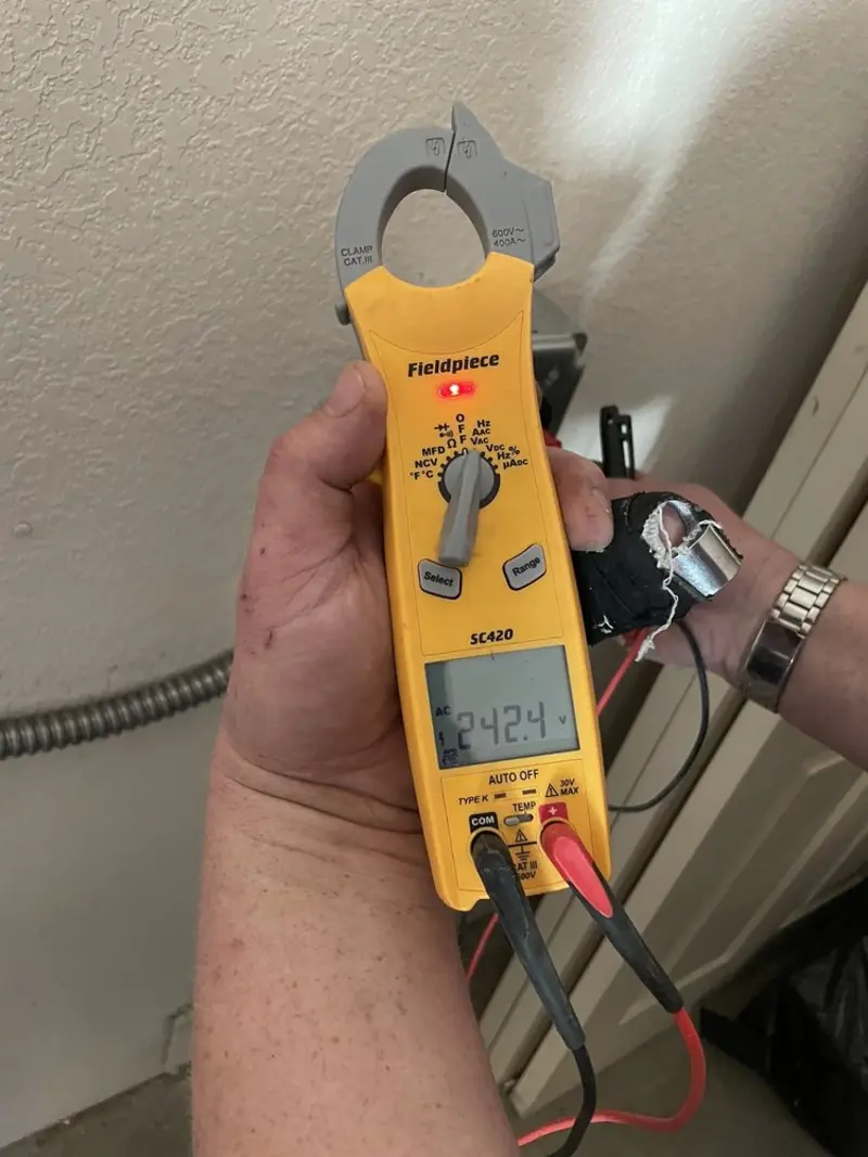 Voltage testing with clamp meter during Electrical Installation Services in Punta Gorda